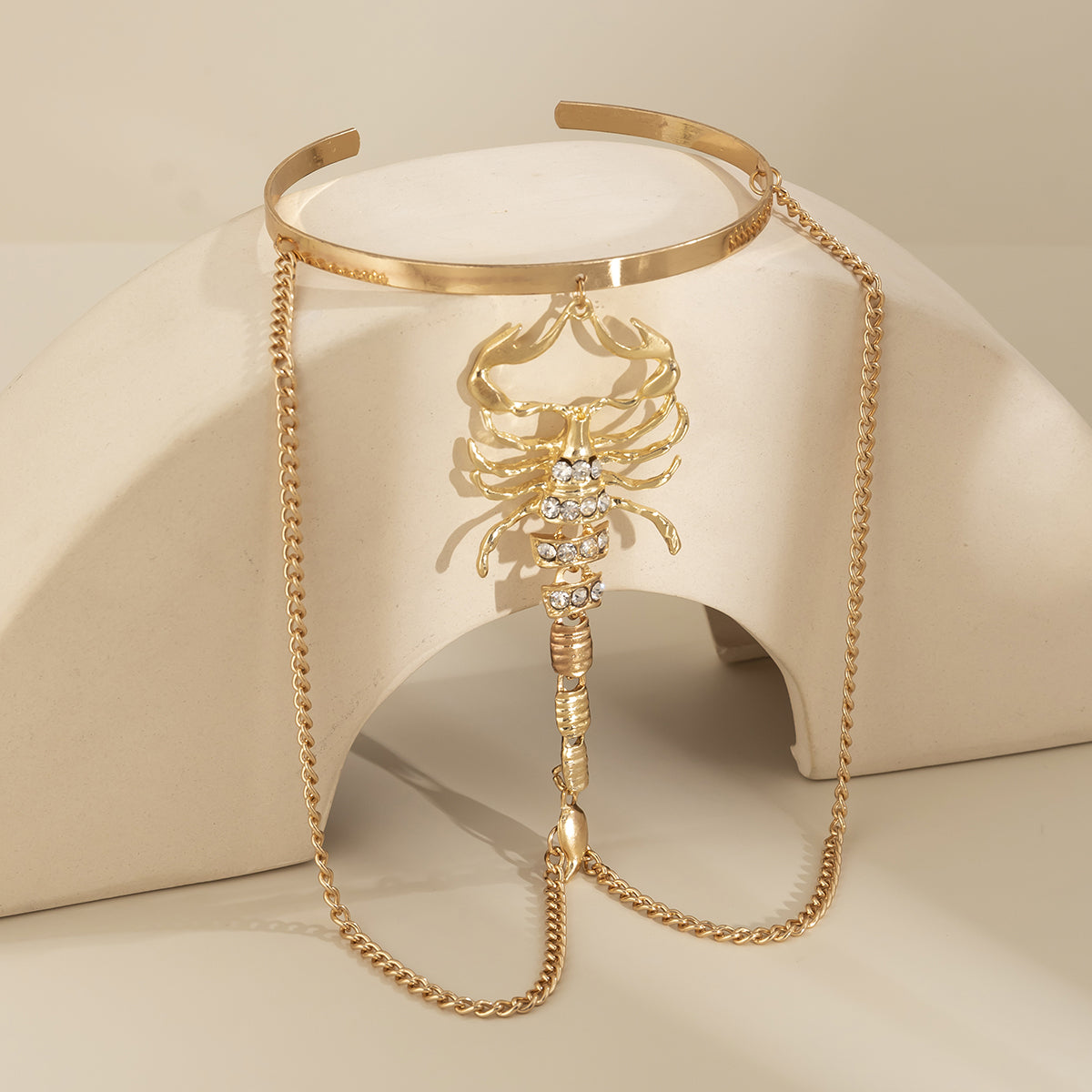 Cubic Zirconia and 18K Gold-Plated Chain Scorpion Arm Cuff, vintage-inspired design, detail close-up