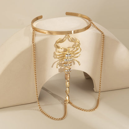 Cubic Zirconia and 18K Gold-Plated Chain Scorpion Arm Cuff, vintage-inspired design, detail close-up