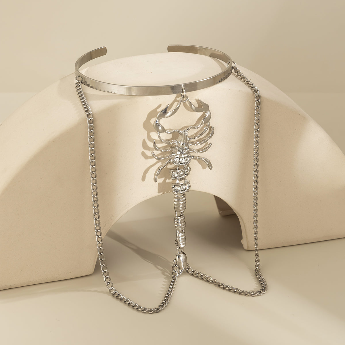 Cubic Zirconia and Silver-Plated Scorpion Chain Arm Cuff, botanical inspired, detail close-up