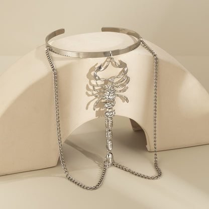 Cubic Zirconia and Silver-Plated Scorpion Chain Arm Cuff, botanical inspired, detail close-up