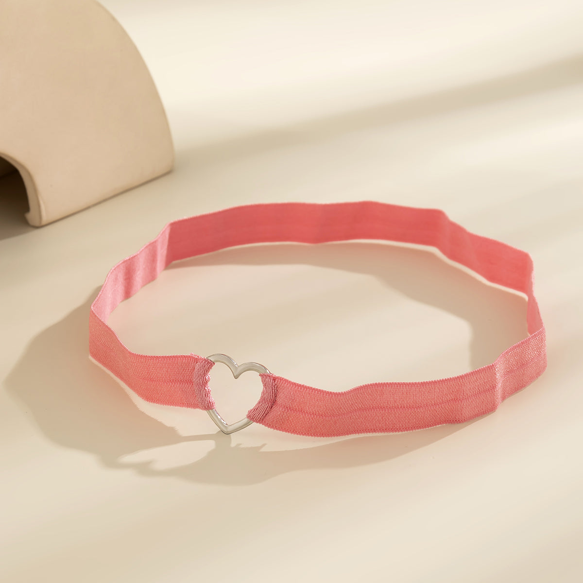 Pink Nylon and Silver-Plated Heart Garter, silver pendant necklace for women, vintage-inspired design, lifestyle look