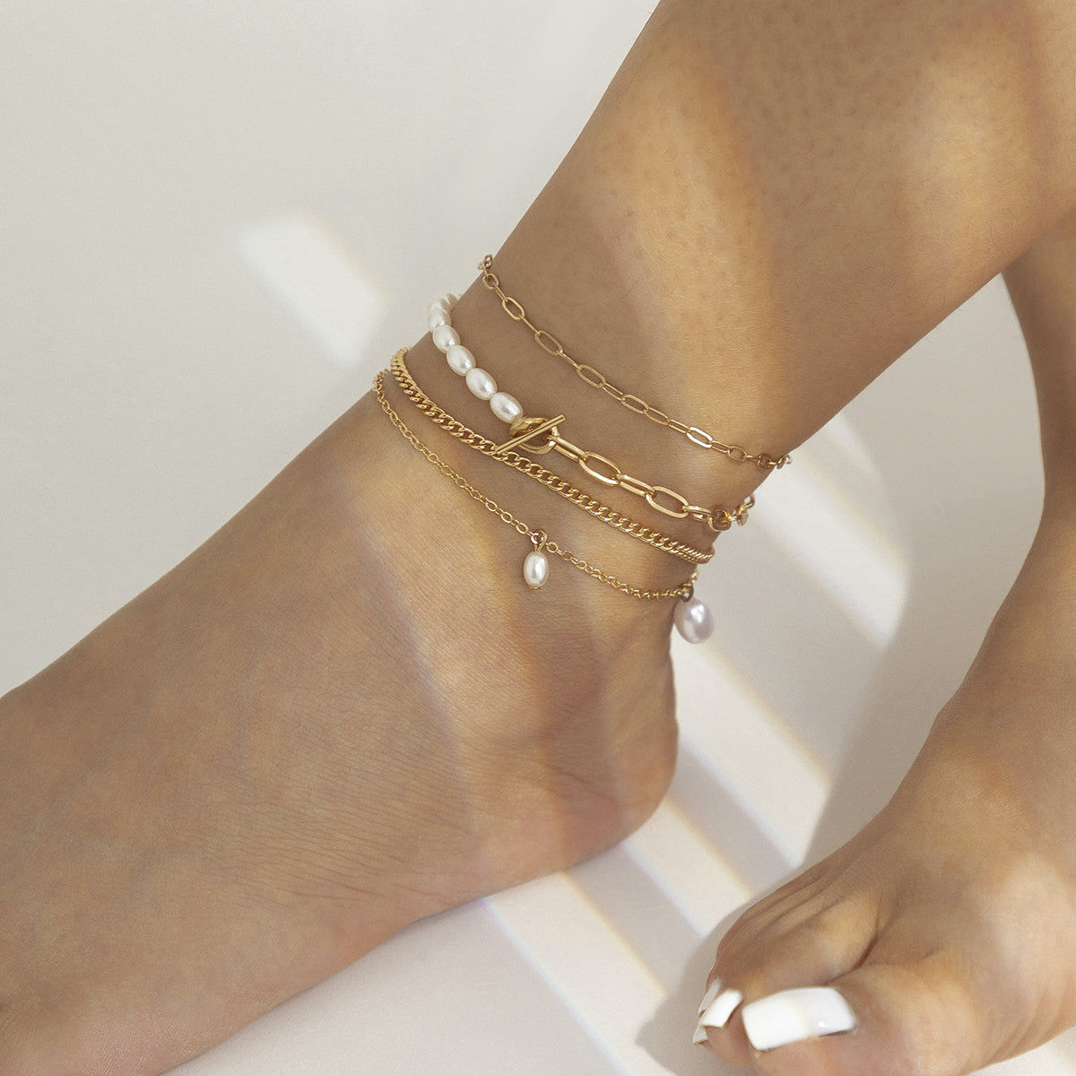 Pearl and 18K Gold-Plated Four-Piece Toggle Anklet Set, jewelry gift sets for women, botanical inspired, detail close-up