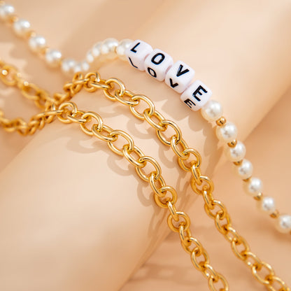 Pearl and Acrylic 18K Gold-Plated 'Love' Necklace Set, jewelry gift sets for women, dainty minimalist design, detail close-up