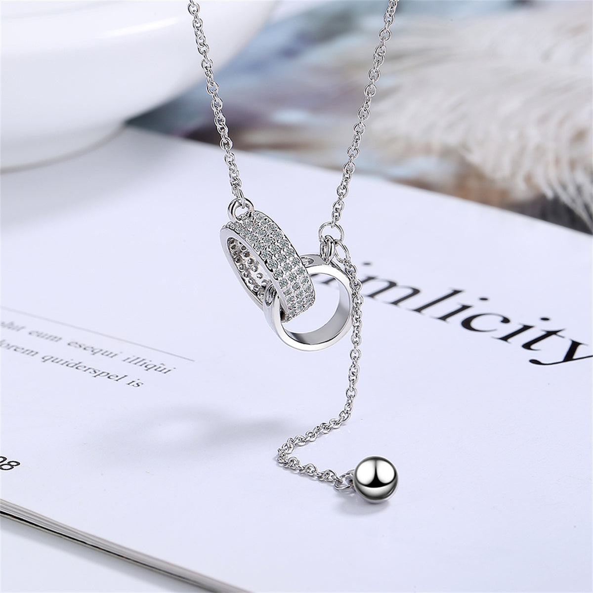 Cubic Zirconia and Silver-Plated Interlocked Rings Lariat Necklace, silver pendant necklace for women, detail close-up