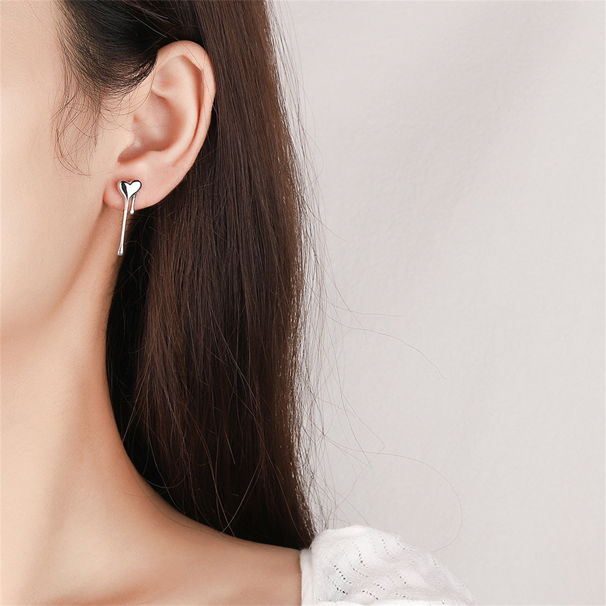 Silver-Plated Melting Heart Stud Earring, silver stud earrings for women, dainty minimalist design, styled look