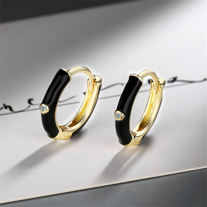 Black Enamel and Cubic Zirconia 18K Gold-Plated Huggie Earrings, gold huggie earrings, botanical inspired, side view