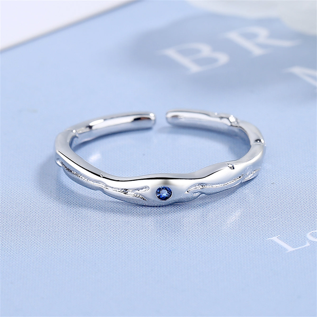 Blue Cubic Zirconia and Silver-Plated Open Ring, silver statement rings for women, vintage-inspired design, front view