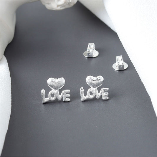 Silver-Plated Heart 'Love' Stud Earrings, silver stud earrings for women, dainty minimalist design, front view
