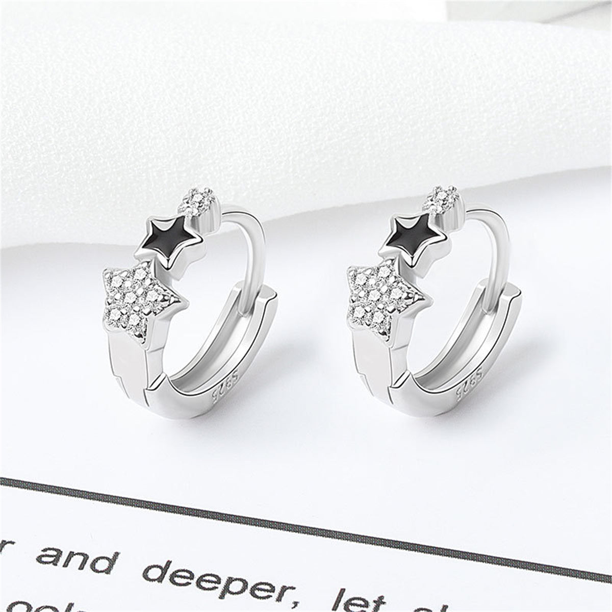 Cubic Zirconia and Enamel Silver-Plated Star Huggie Earrings, silver huggie earrings, botanical inspired, front view