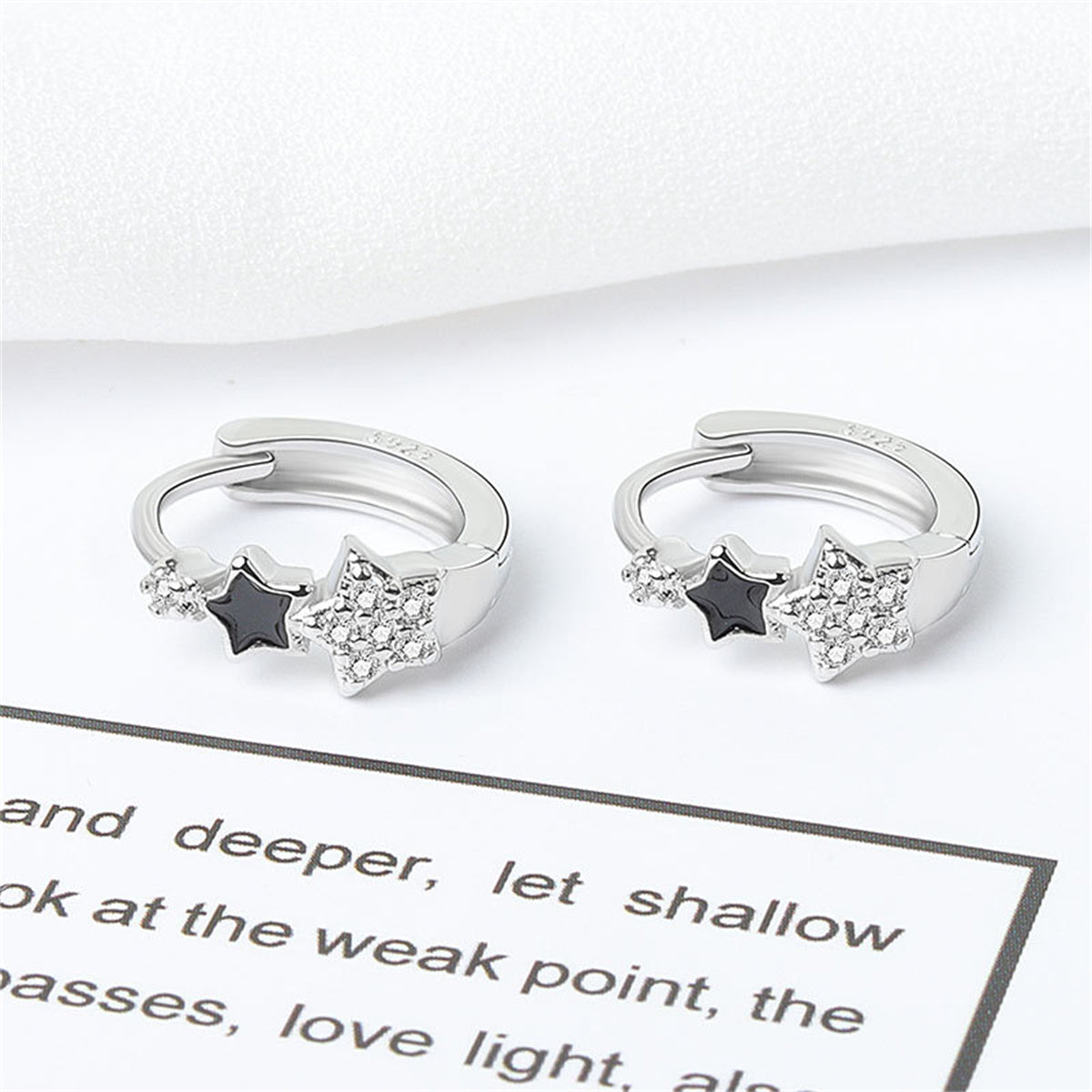 Cubic Zirconia and Enamel Silver-Plated Star Huggie Earrings, silver huggie earrings, botanical inspired, detail close-up
