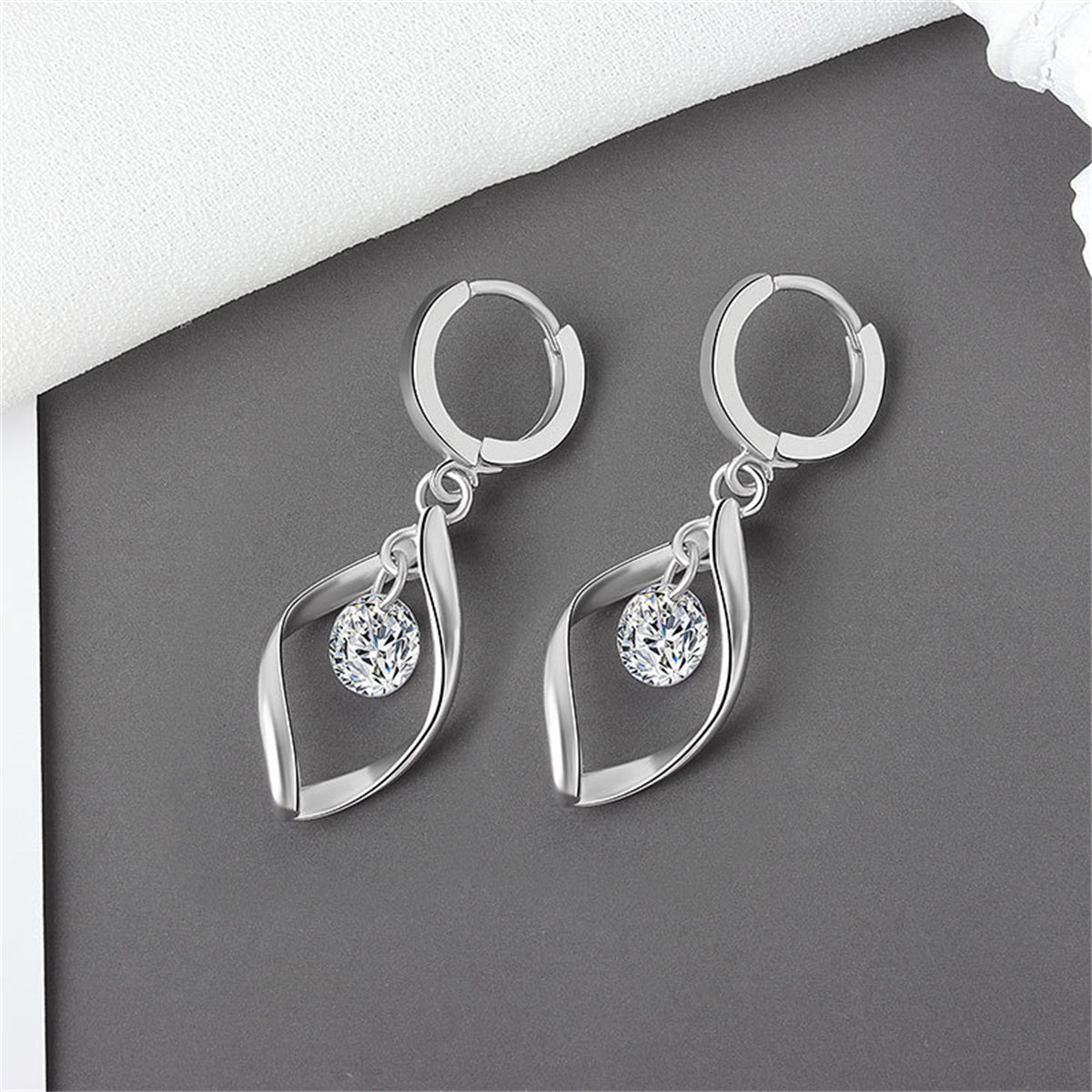 Crystal and Silver-Plated Twisted Drop Huggie Earrings, silver huggie earrings, vintage-inspired design, front view