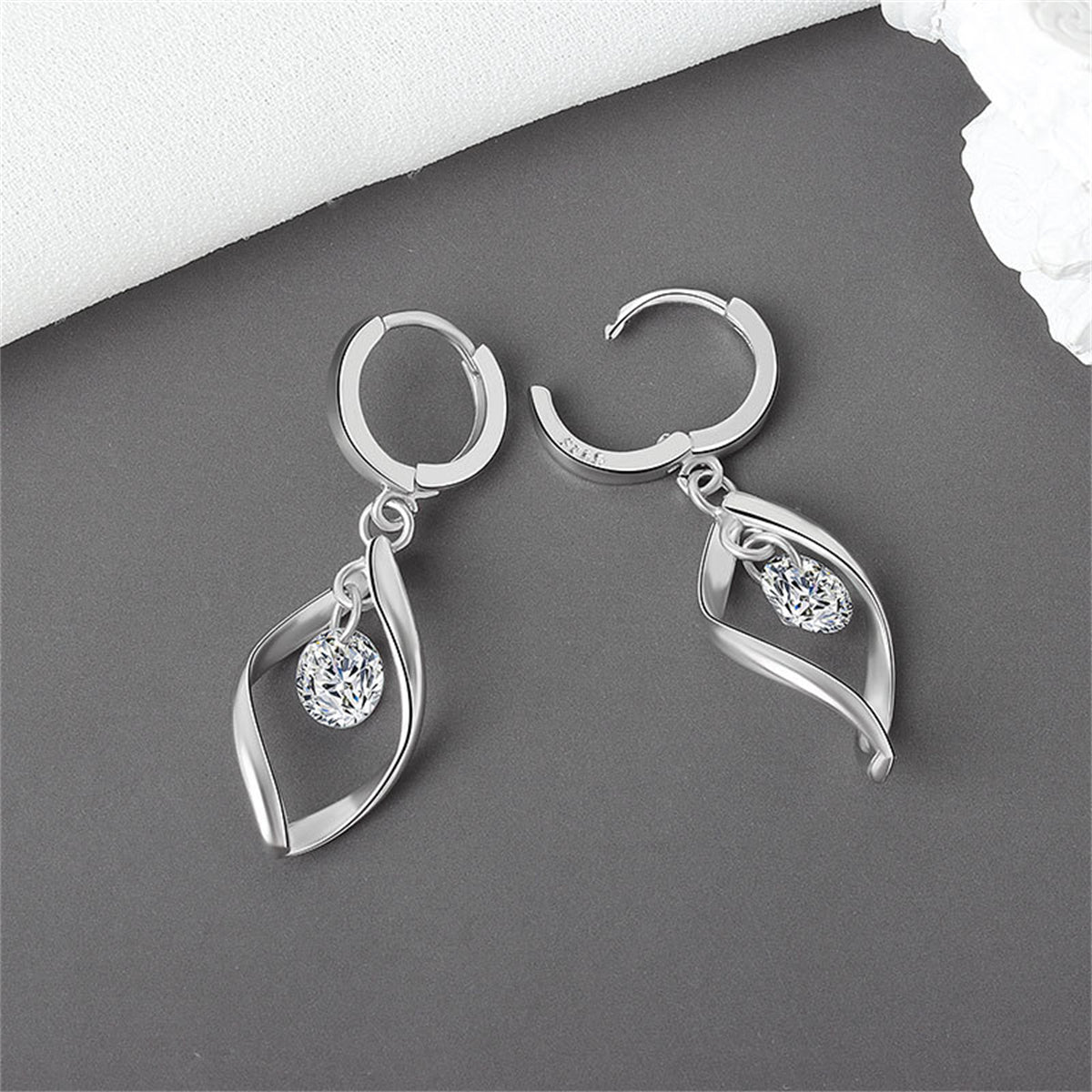 Crystal and Silver-Plated Twisted Drop Huggie Earrings, silver huggie earrings, vintage-inspired design, detail close-up