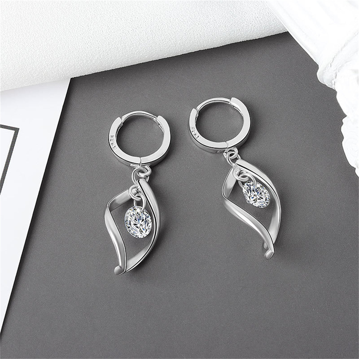 Crystal and Silver-Plated Twisted Drop Huggie Earrings, silver huggie earrings, vintage-inspired design, lifestyle look