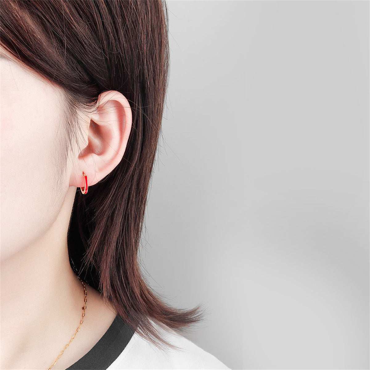 Red Enamel and 18K Gold-Plated Huggie Earrings, gold huggie earrings, vintage-inspired design, detail close-up
