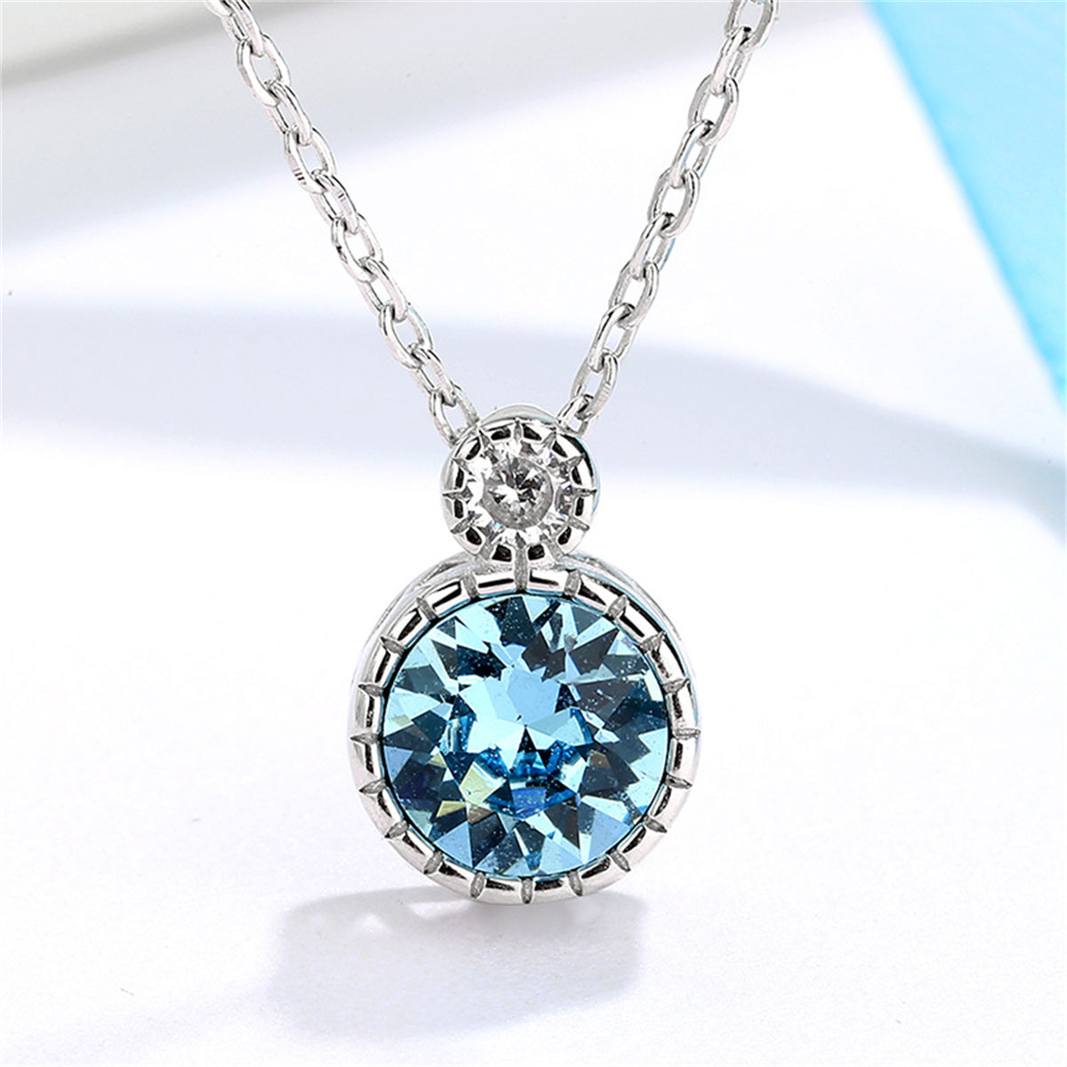 Blue Crystal and Silver-Plated Round Pendant Necklace, silver pendant necklace for women, detail close-up