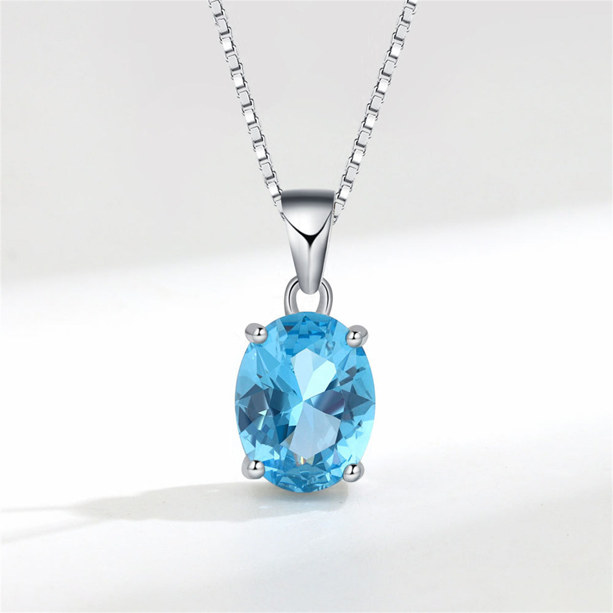 Blue Crystal and Silver-Plated Oval Pendant Necklace, silver pendant necklace for women, botanical inspired, front view