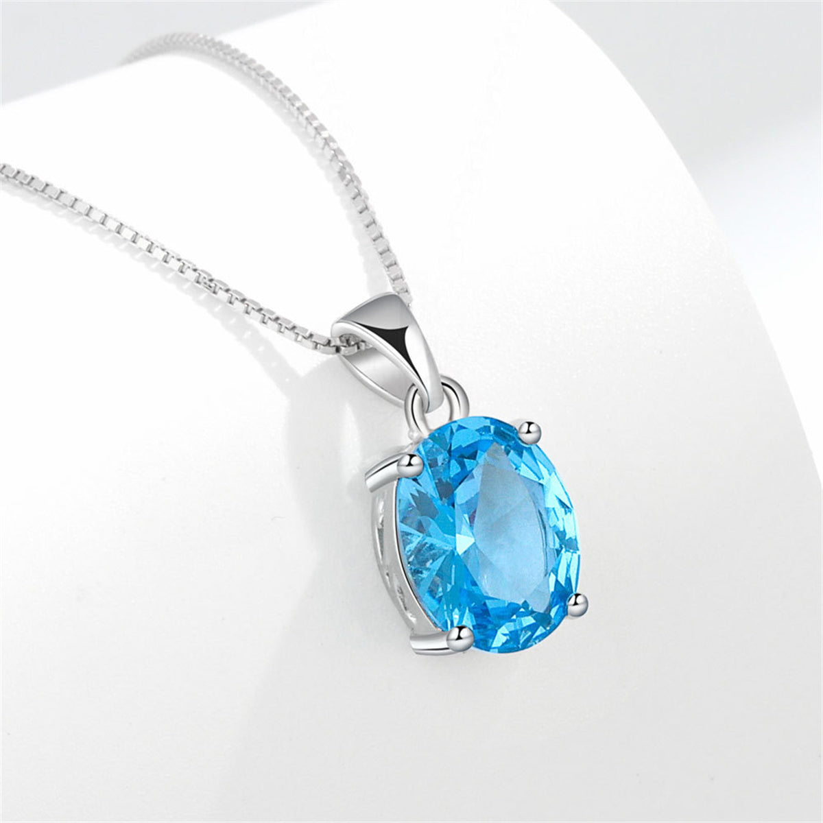 Blue Crystal and Silver-Plated Oval Pendant Necklace, silver pendant necklace for women, botanical inspired, detail close-up