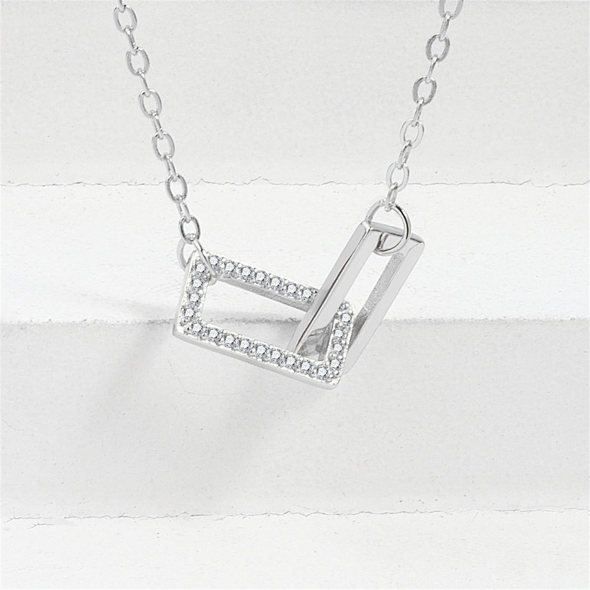Cubic Zirconia and Silver-Plated Interlock Rectangles Pendant Necklace, silver pendant necklace for women, side view