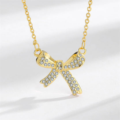 Cubic Zirconia and 18K Gold-Plated Bow Pendant Necklace, gold pendant necklace for women, vintage-inspired design, front view
