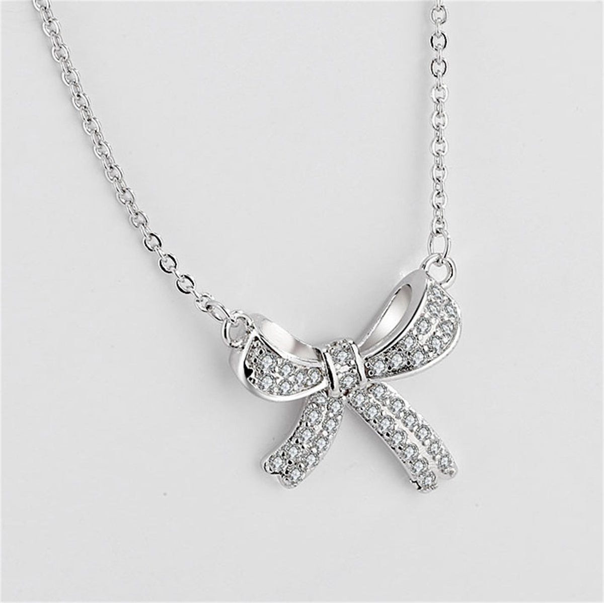 Cubic Zirconia and Silver-Plated Bow Pendant Necklace, silver pendant necklace for women, front view