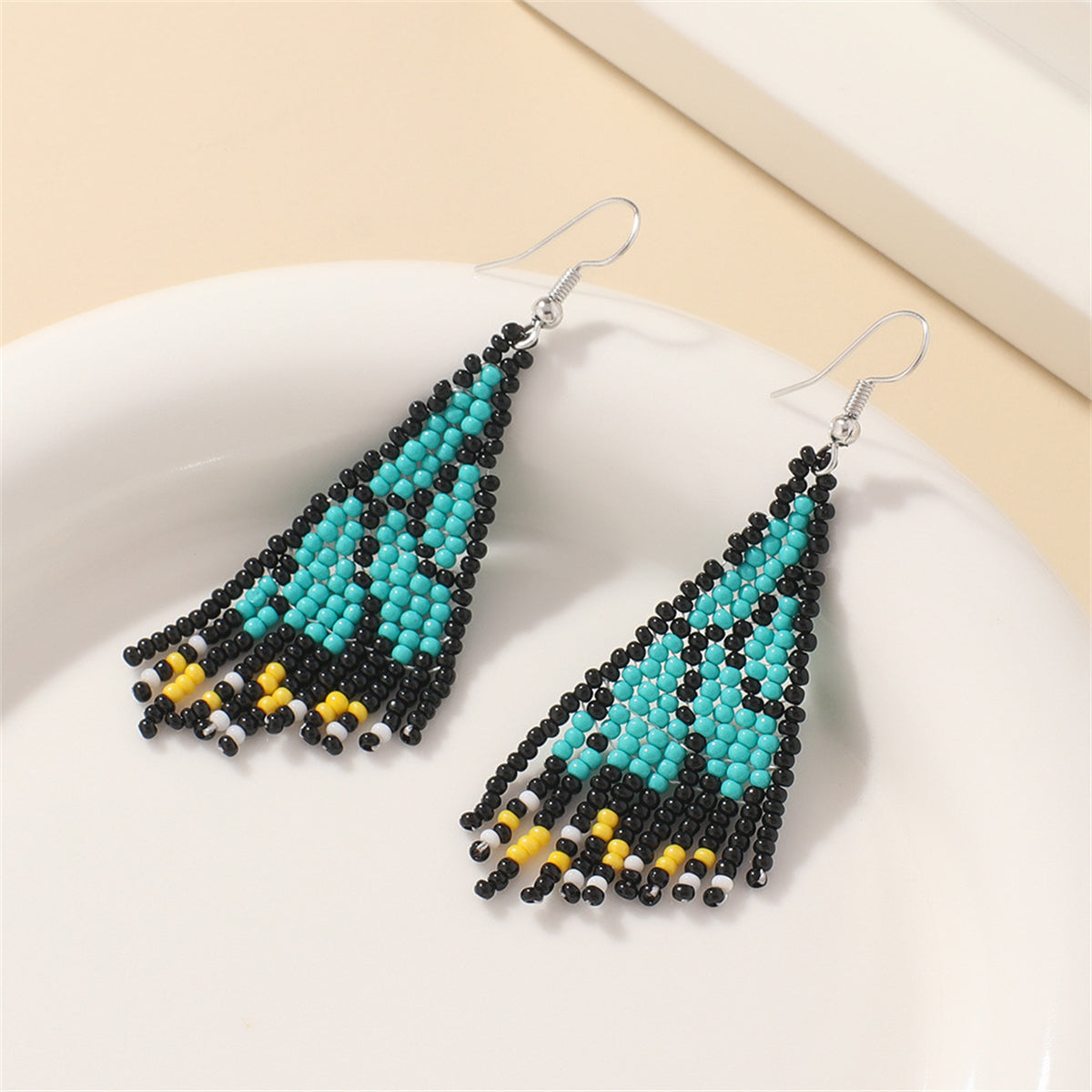 Green and Black Howlite Butterfly Tassel Drop Earrings, drop earrings for women, dainty minimalist design, detail close-up