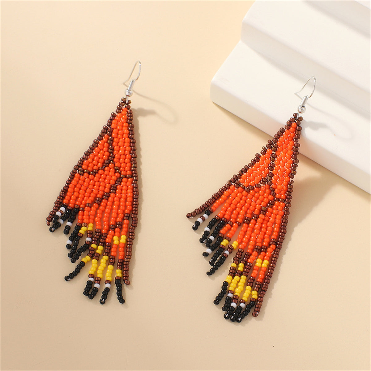 Orange and Black Howlite Butterfly Tassel Drop Earrings, drop earrings for women, vintage-inspired design, styled look
