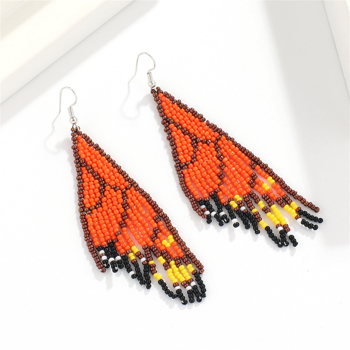 Orange and Black Howlite Butterfly Tassel Drop Earrings, drop earrings for women, vintage-inspired design, side view