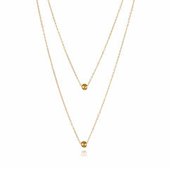 18K gold-plated double layer necklace adorned with two beautiful gold balls, perfect for elevating any outfit.