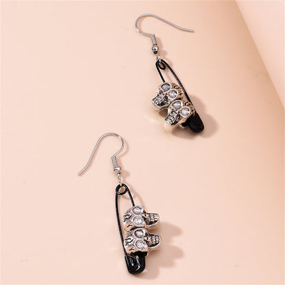 Black and Silver-Plated Skull Pin Drop Earrings, silver drop earrings for women, dainty minimalist design, detail close-up