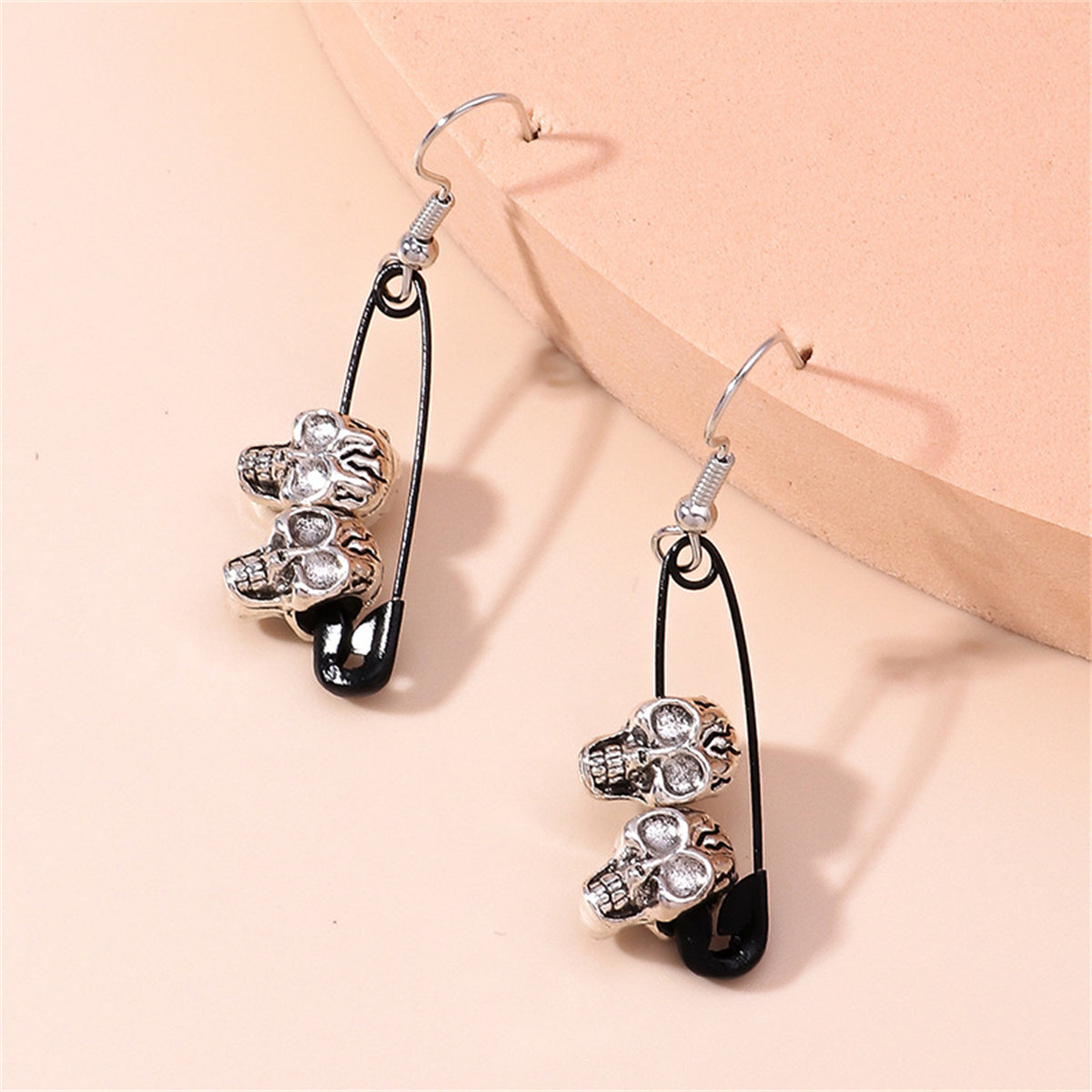 Black and Silver-Plated Skull Pin Drop Earrings, silver drop earrings for women, dainty minimalist design, lifestyle look