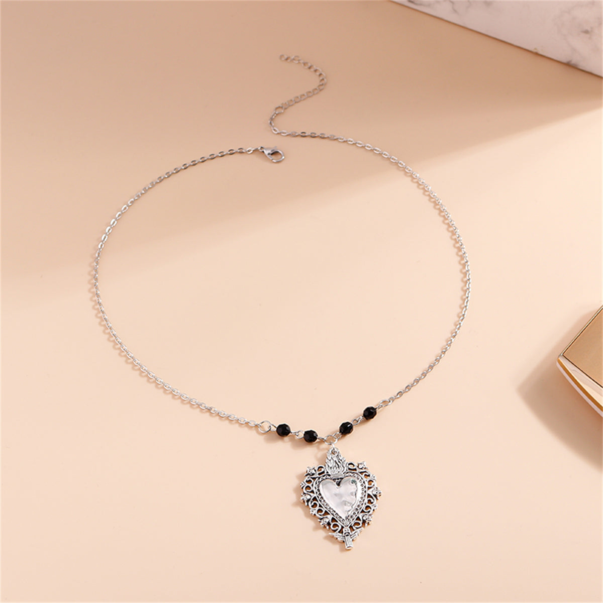 Black Acrylic and Silver-Plated Floral Heart Pendant Necklace, silver pendant necklace for women, detail close-up