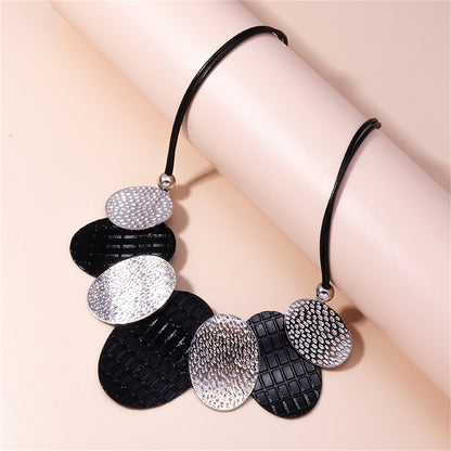 Black Polystyrene and Silver-Plated Oval Statement Necklace, silver pendant necklace for women, botanical inspired, side view