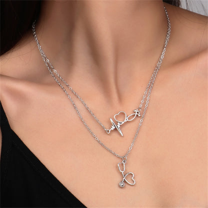 Silver-Plated Heartbeat and Stethoscope Pendant Layered Necklace, silver pendant necklace for women, front view
