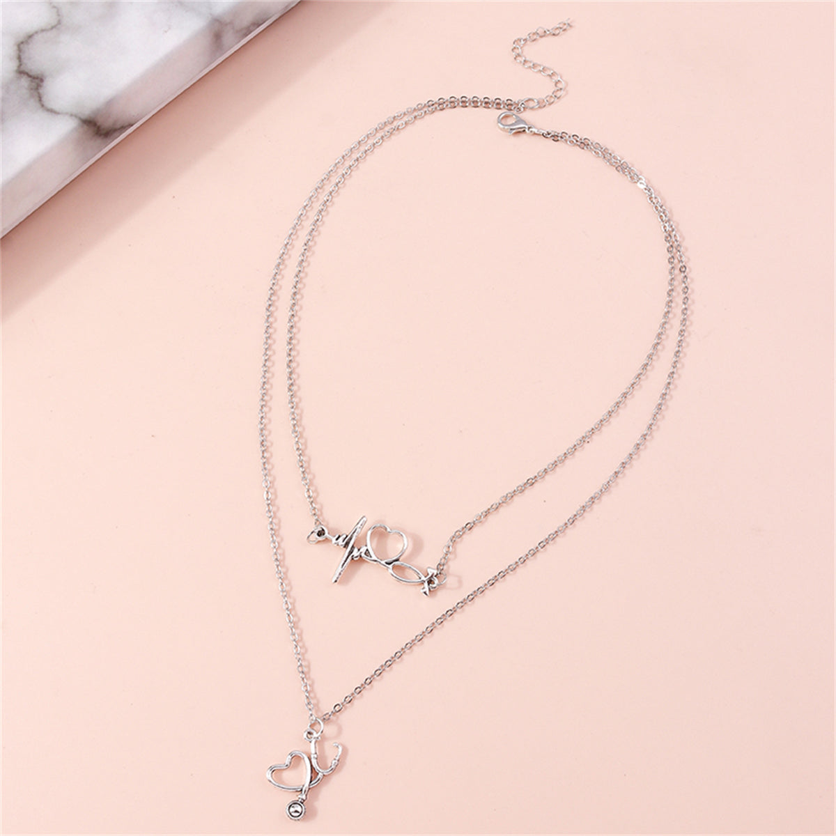 Silver-Plated Heartbeat and Stethoscope Pendant Layered Necklace, silver pendant necklace for women, detail close-up