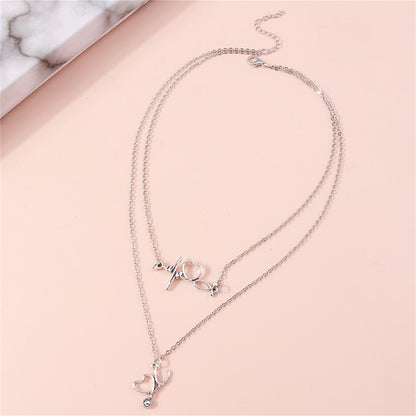 Silver-Plated Heartbeat and Stethoscope Pendant Layered Necklace, silver pendant necklace for women, detail close-up