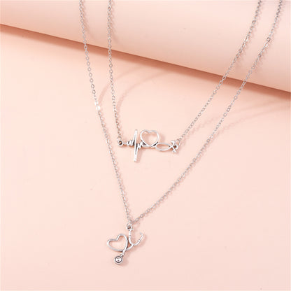 Silver-Plated Heartbeat and Stethoscope Pendant Layered Necklace, silver pendant necklace for women, lifestyle look
