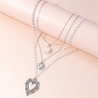 Pearl and Silver-Plated Moon Sun Heart Pendant Layered Necklace, jewelry gift sets for women, botanical inspired, side view