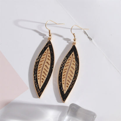 Black Polyurethane and 18K Gold-Plated Leaf Drop Earrings, gold drop earrings for women, vintage-inspired design, front view