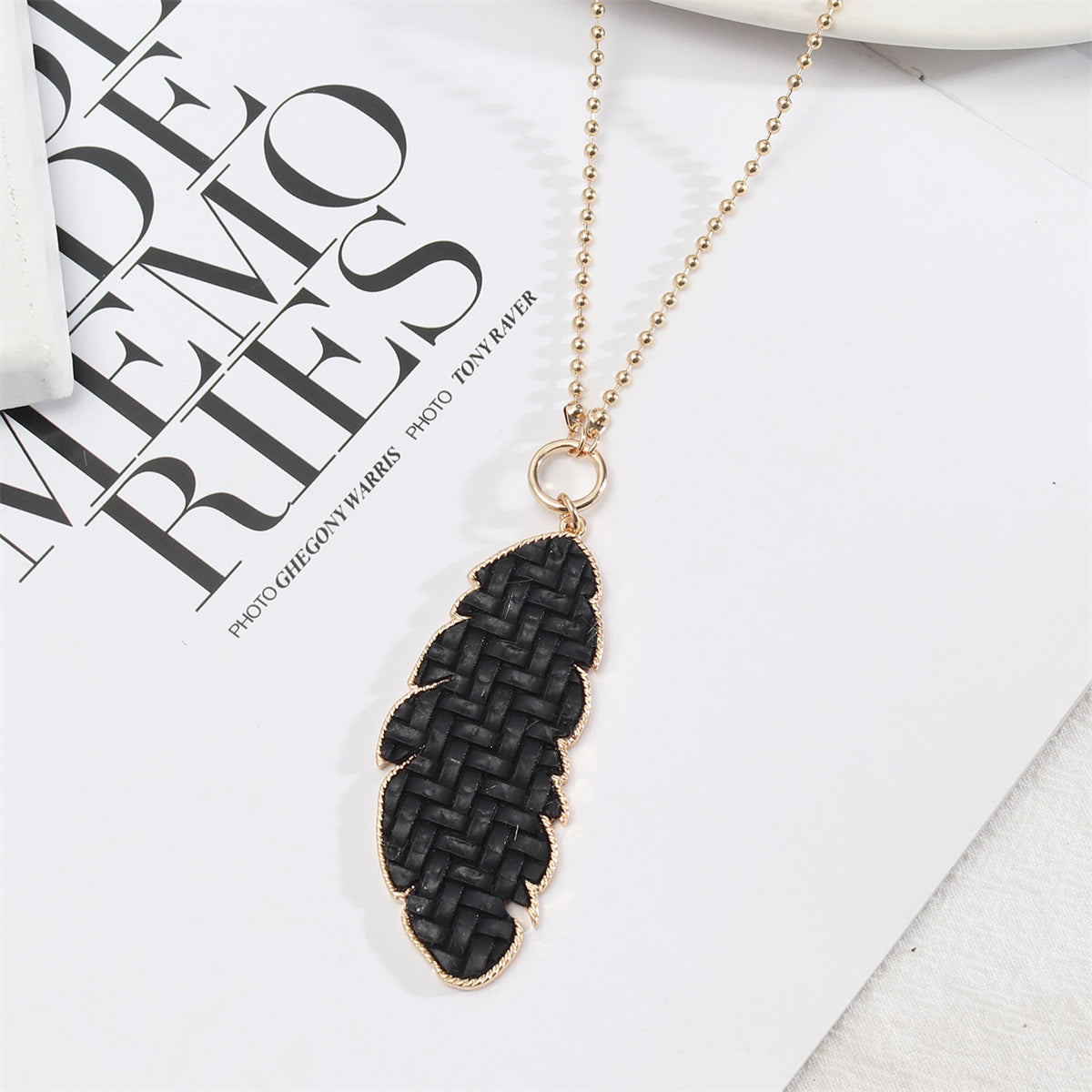Black Polyurethane and 18K Gold-Plated Weave Leaf Pendant Necklace, gold pendant necklace for women, front view