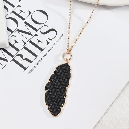 Black Polyurethane and 18K Gold-Plated Weave Leaf Pendant Necklace, gold pendant necklace for women, front view
