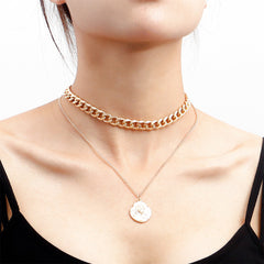 Elegant 18K gold-plated curb chain necklace featuring a stylish coin charm pendant for a chic layered look.