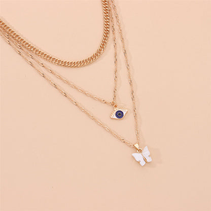 White Acrylic and 18K Gold-Plated Butterfly and Eye Layered Pendant Necklace, gold pendant necklace for women, lifestyle look