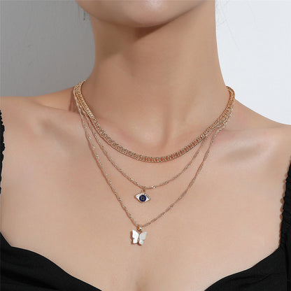 White Acrylic and 18K Gold-Plated Butterfly and Eye Layered Pendant Necklace, gold pendant necklace for women, side view