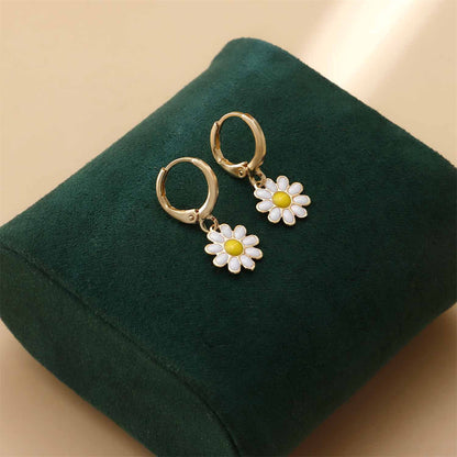 White Enamel and 18K Gold-Plated Daisies Huggie Earrings, gold huggie earrings, dainty minimalist design, side view