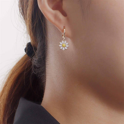 White Enamel and 18K Gold-Plated Daisies Huggie Earrings, gold huggie earrings, dainty minimalist design, lifestyle look