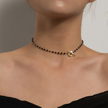Black Acrylic and 18K Gold-Plated Floral Choker Necklace, chunky gold choker necklace, botanical inspired, front view