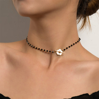 Black Acrylic and 18K Gold-Plated Floral Choker Necklace, chunky gold choker necklace, botanical inspired, side view