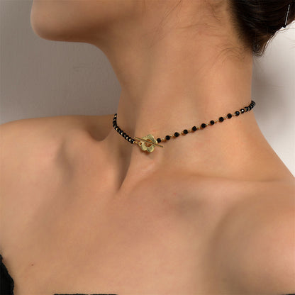 Black Acrylic and 18K Gold-Plated Floral Choker Necklace, chunky gold choker necklace, botanical inspired, detail close-up