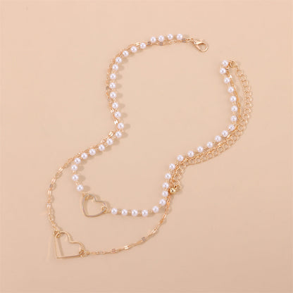 Pearl and 18K Gold-Plated Heart Layered Pendant Necklace, gold pendant necklace for women, detail close-up