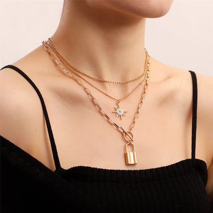 Cubic Zirconia and 18K Gold-Plated Lock Star Layered Pendant Necklace, jewelry gift sets for women, front view